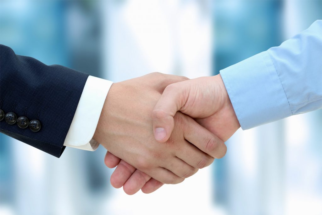 Firm business handshake