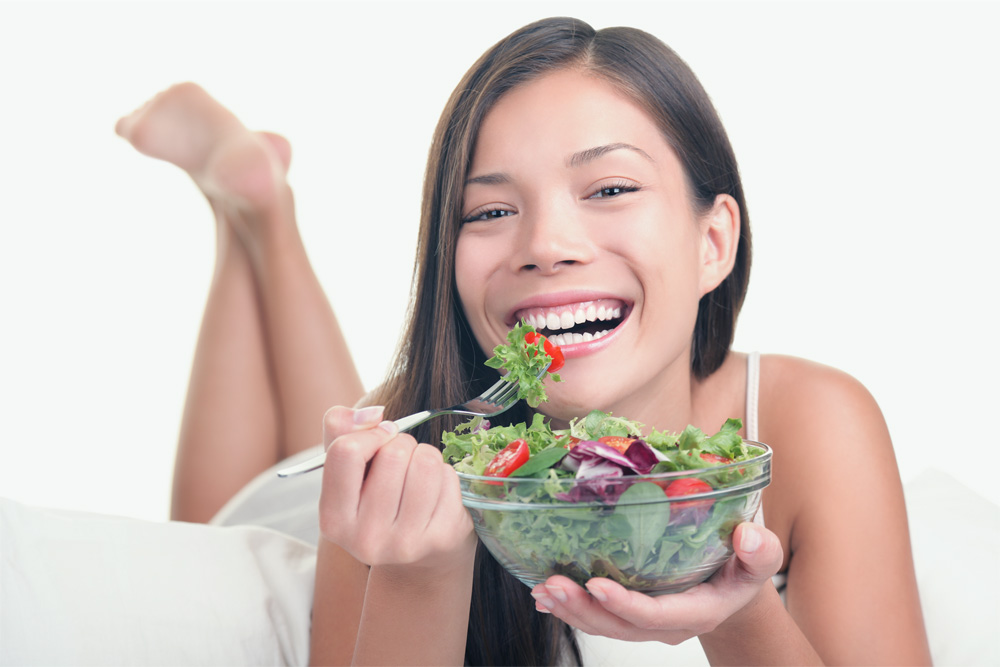Stock photo girl eating a salad